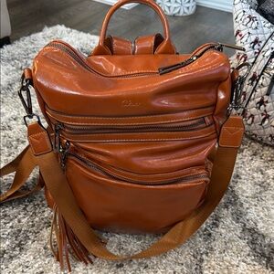 Tan Leather Convertible Backpack with Tassel Detail